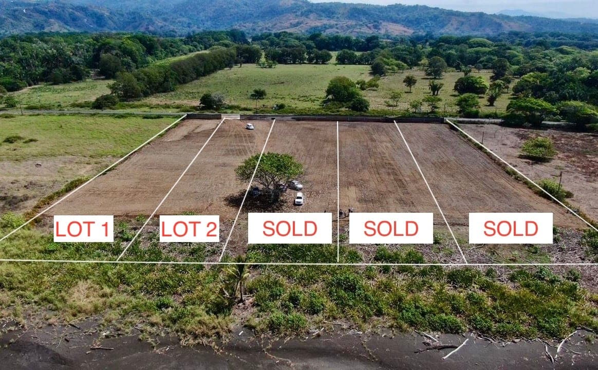 Drone view of the beachfront lots at Hermosa Real, with Lots 1 and 2 available