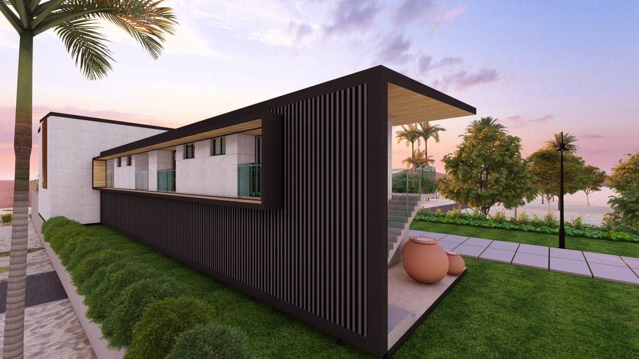 A sunset terrace of a single-level home opening toward the Playa Hermosa shoreline